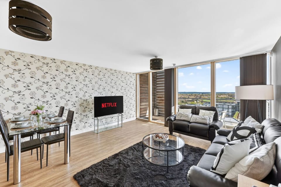 A spacious open-plan living, dining, and kitchen area.