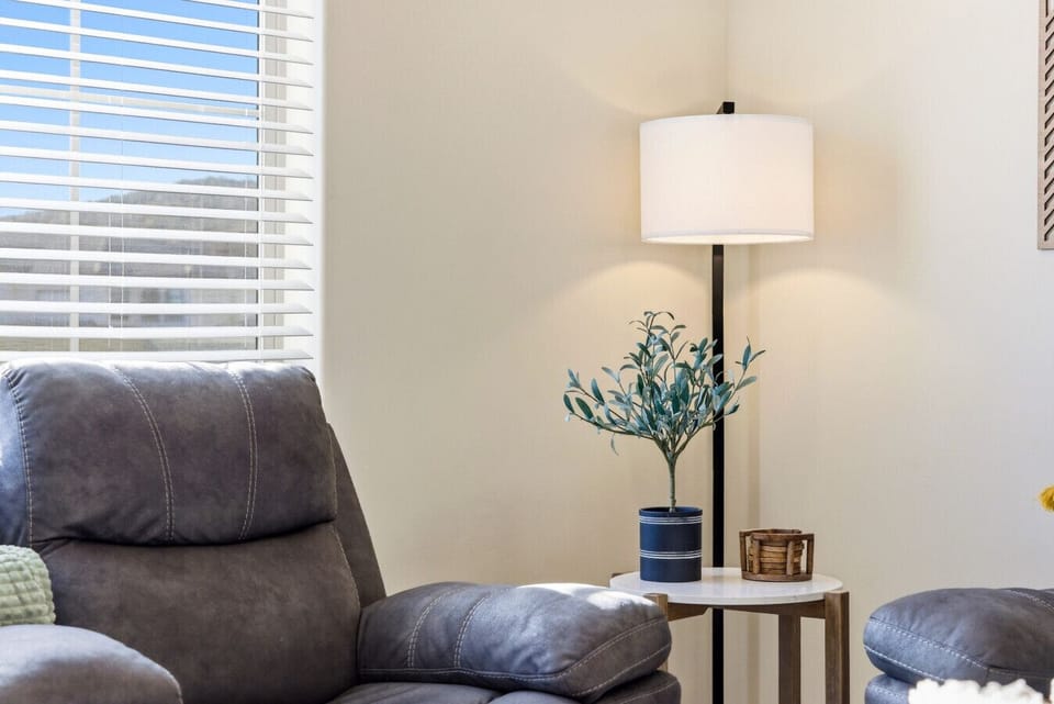 Living Room Retreat: Relax in style with plush seating and refreshing mountain views!