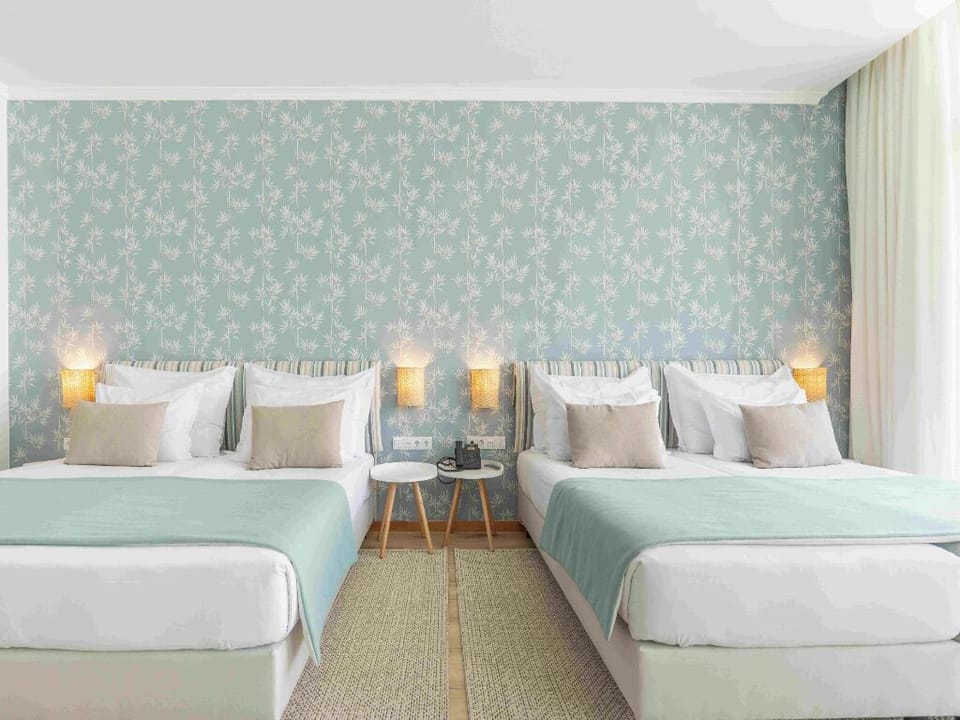 Drift off in twin beds dressed in hotel-soft layers.