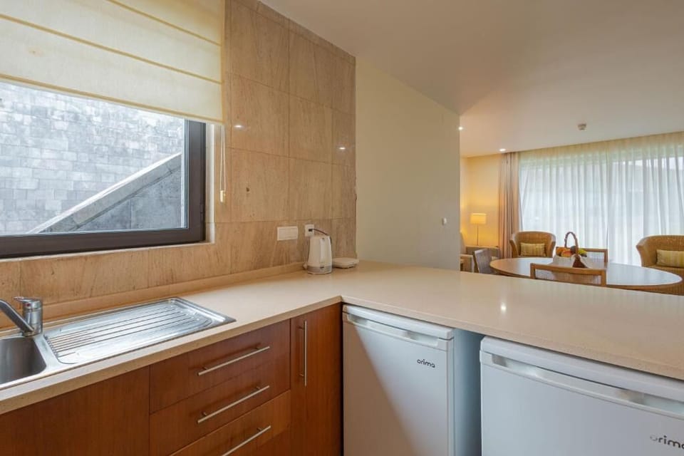 Prepare snacks on generous counters with handy fridge access.