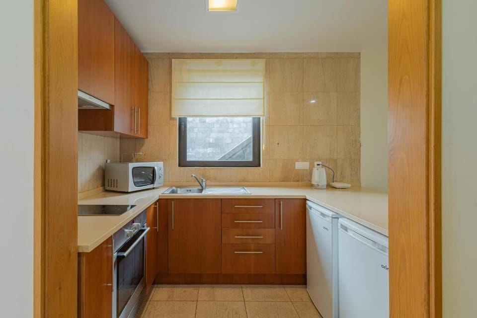 Cook with ease in a fully equipped, functional kitchenette.