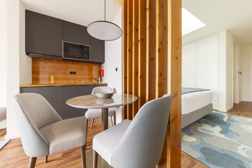 Sip morning coffee beside the stylish, compact kitchenette.