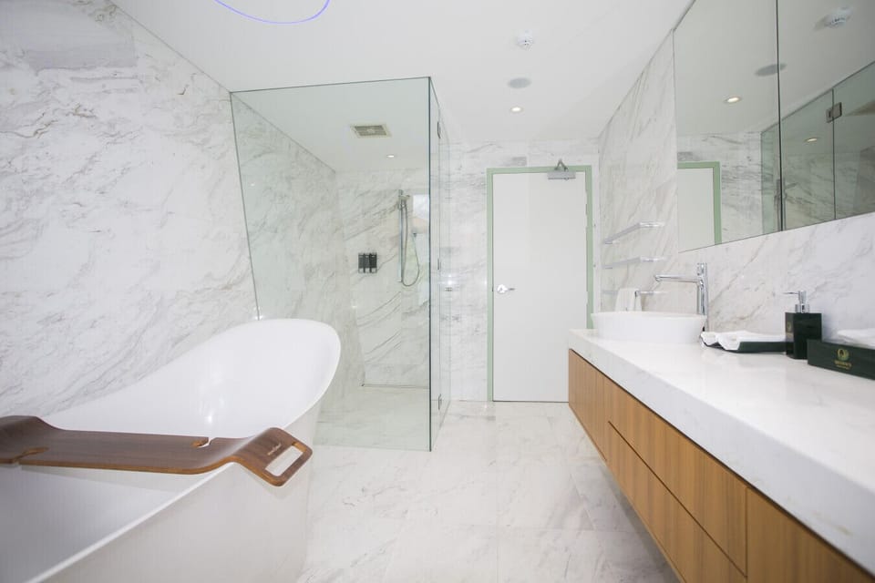 Luxury bathroom with full bath and double sized shower, perfect to unwind at the end of a busy day.