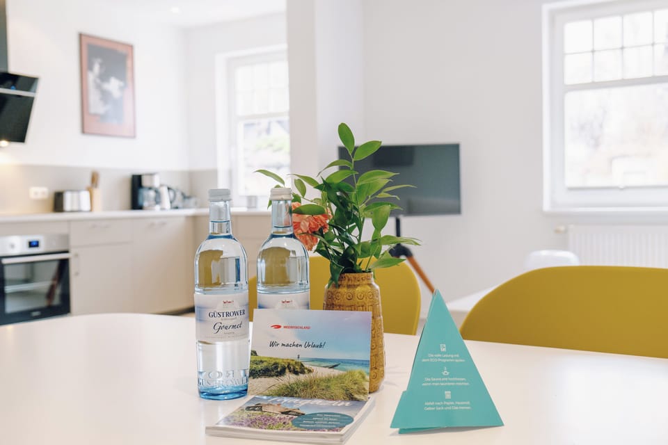 Modern Kitchen with Water Bottles and Flowers