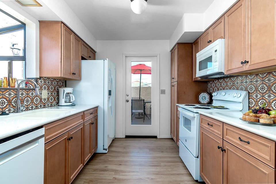 Kitchen leads to a small patio