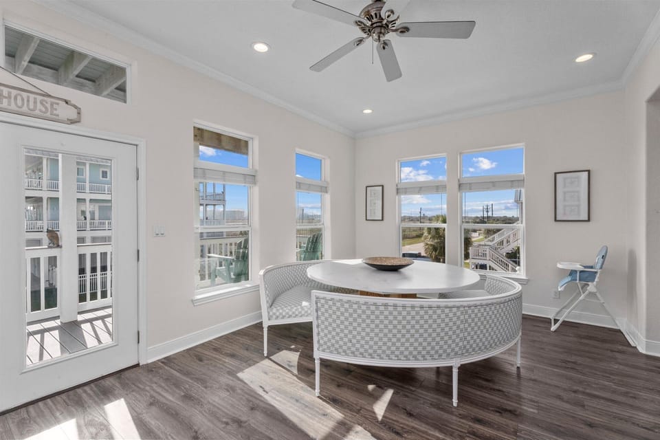 Elegant dining and gathering space with open layout, perfect for family dinners during your Galveston beach vacation.