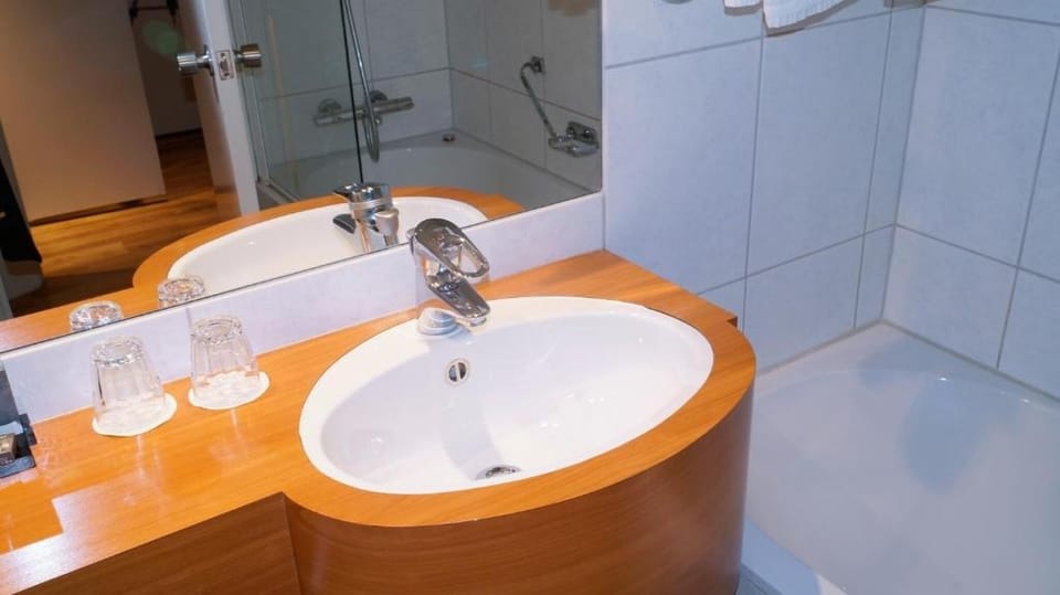 Freshen up with a roomy vanity and an easy soak.