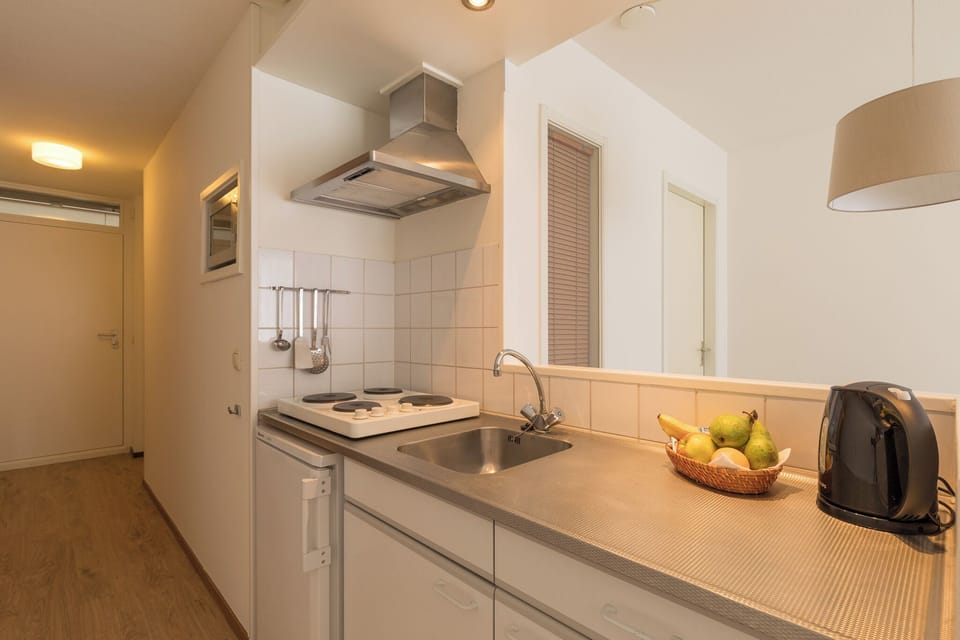 Cook simple meals easily in the practical, well-lit kitchenette.