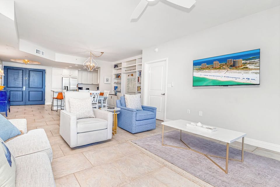 Relax in your bright, coastal-inspired living space with plush seating and modern amenities.