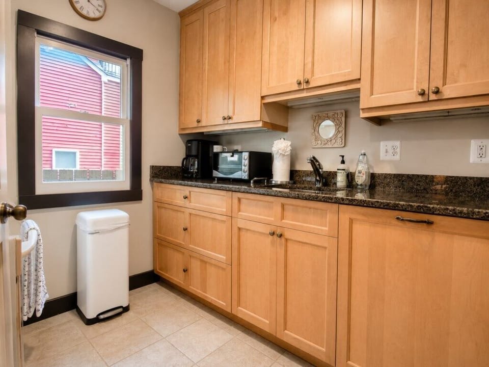 Full kitchen with granite counters and all the kitchen essentials