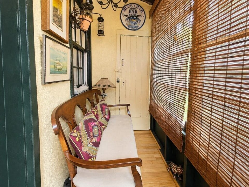The enclosed porch adds another charming nook to this historic-style home.