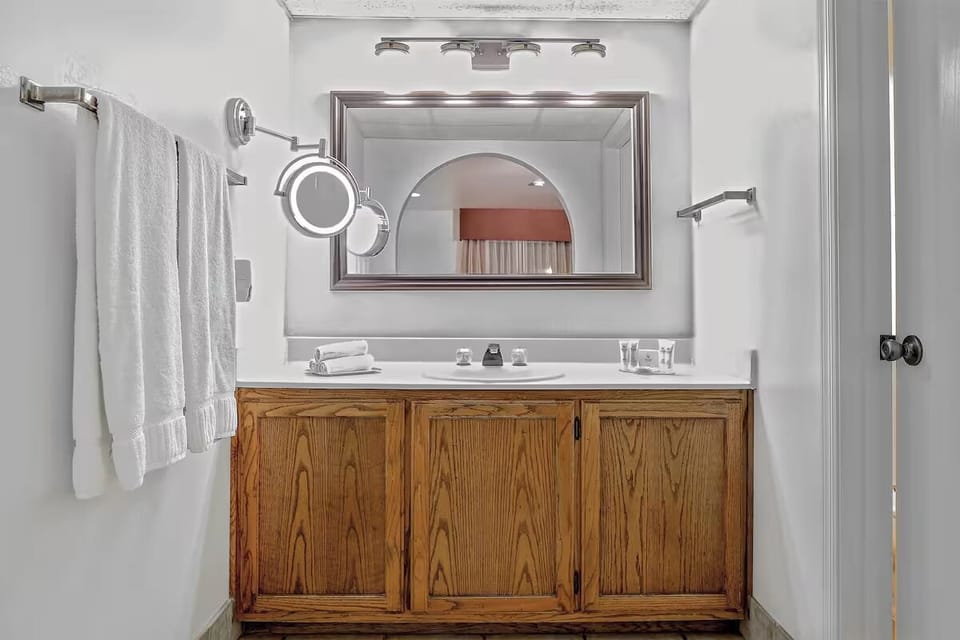 Refresh at the bright vanity with fluffy towels ready