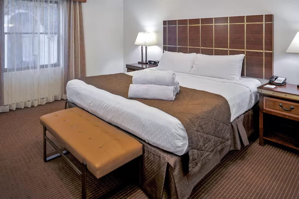 Unwind into crisp linens and enjoy a peaceful night’s sleep
