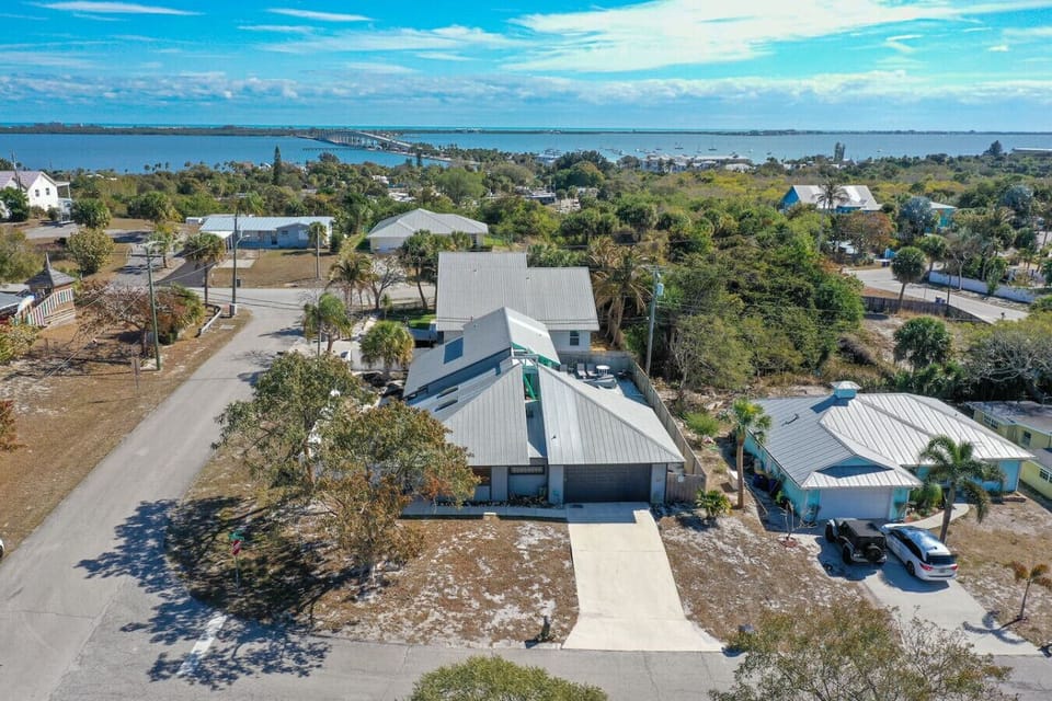 Aerial view of the house showing proximity to water