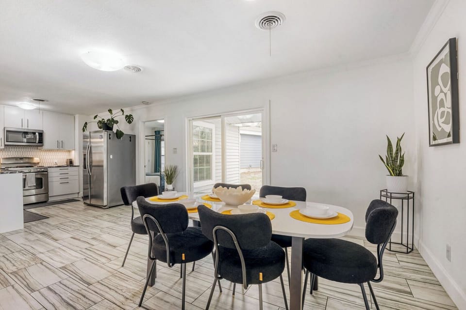 Modern dining space with seating for six, perfect for shared meals or game nights