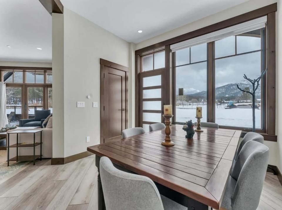 Sunlit dining area with scenic window views and modern charm