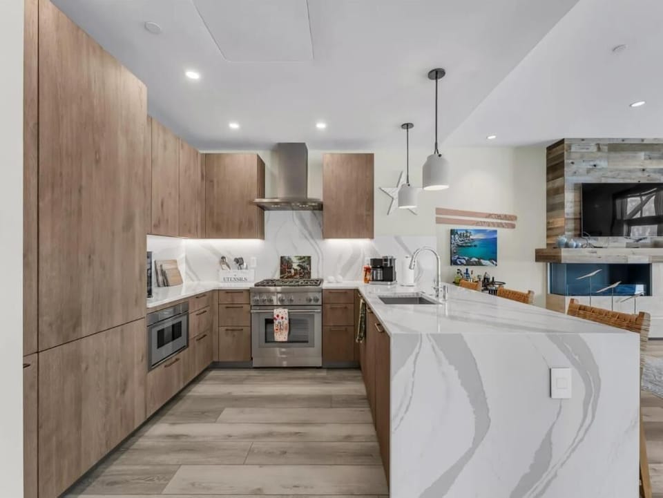 Sleek modern kitchen with spacious island and elegant lighting