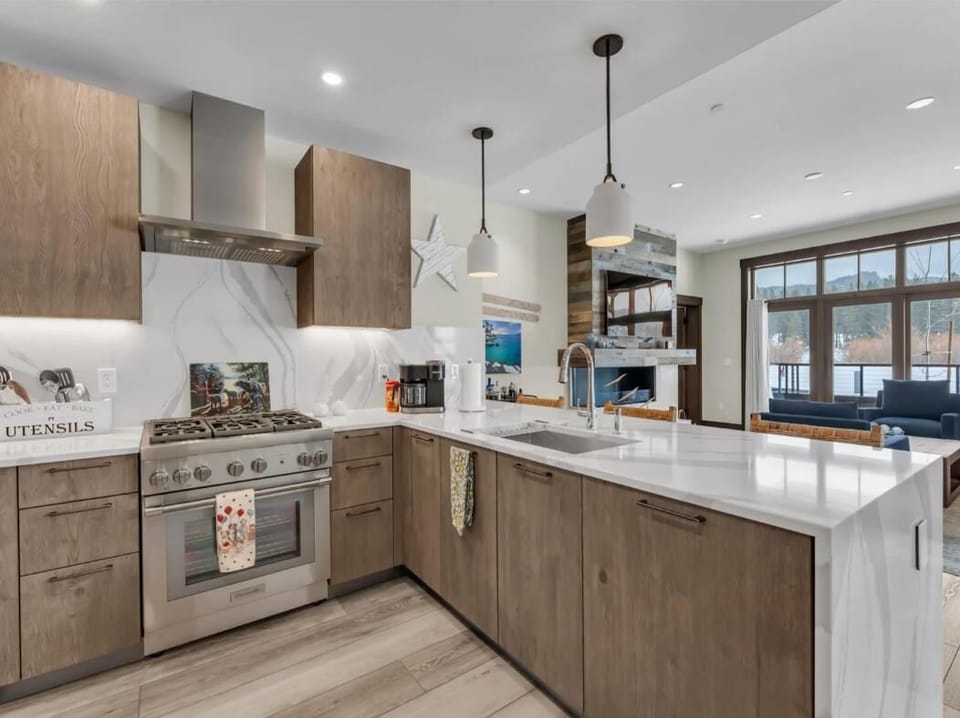 Modern kitchen with sleek appliances and spacious island seating