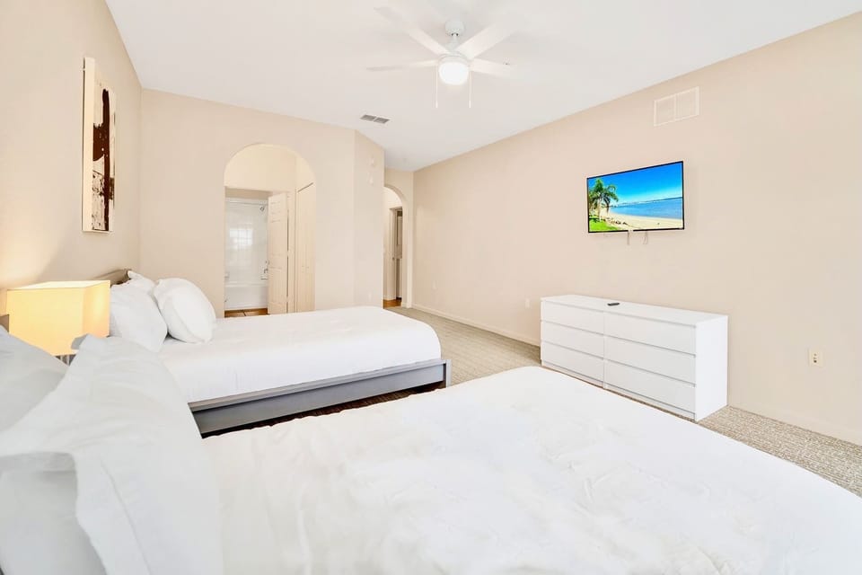 Twin double bedroom with en-suite bathroom and smart TV