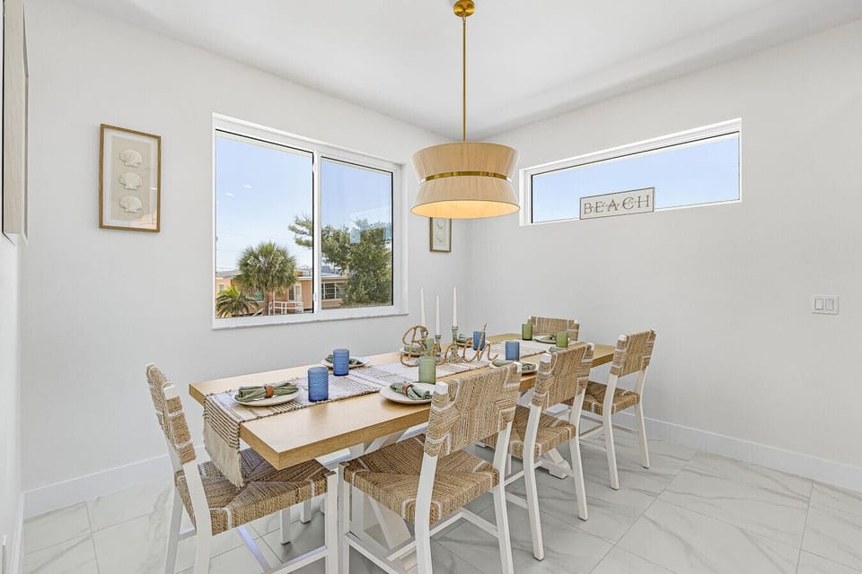 Beautifully styled dining area offering plenty of seating for the whole family to gather and enjoy meals together.