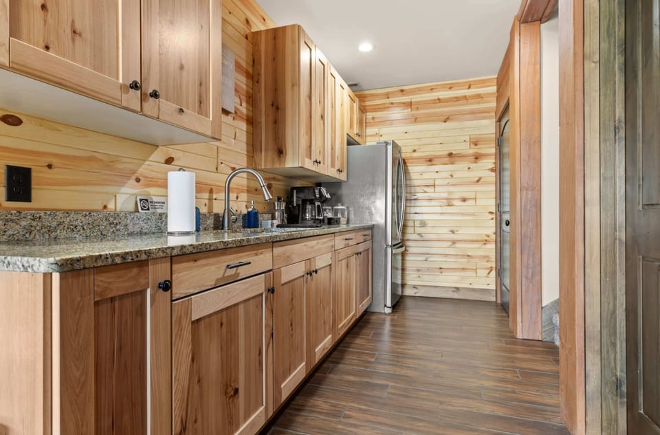 The kitchenette is conveniently located on the lower level, perfect for easy snack preparation during your stay.