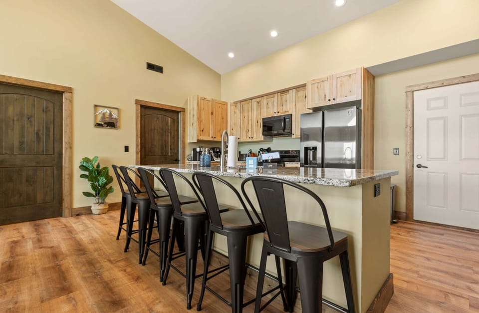 This kitchen island provides additional seating for your convenience.