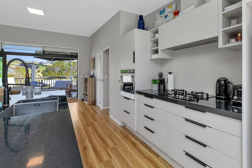 Modern kitchen with breakfast bar and outdoor flow