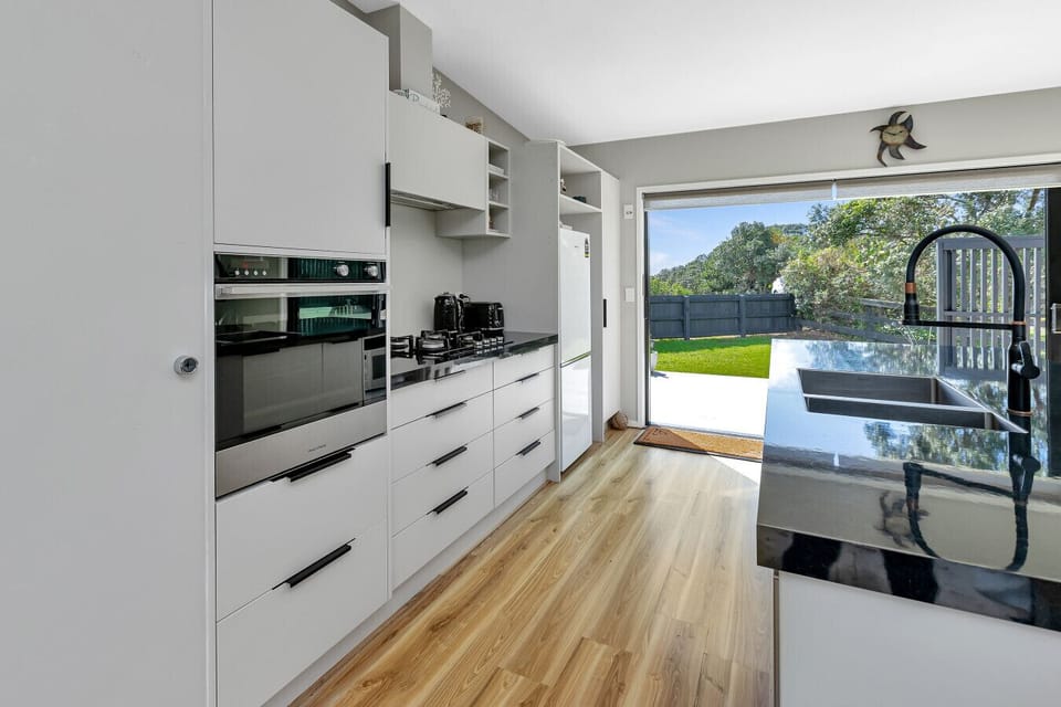 Modern kitchen with breakfast bar and outdoor flow