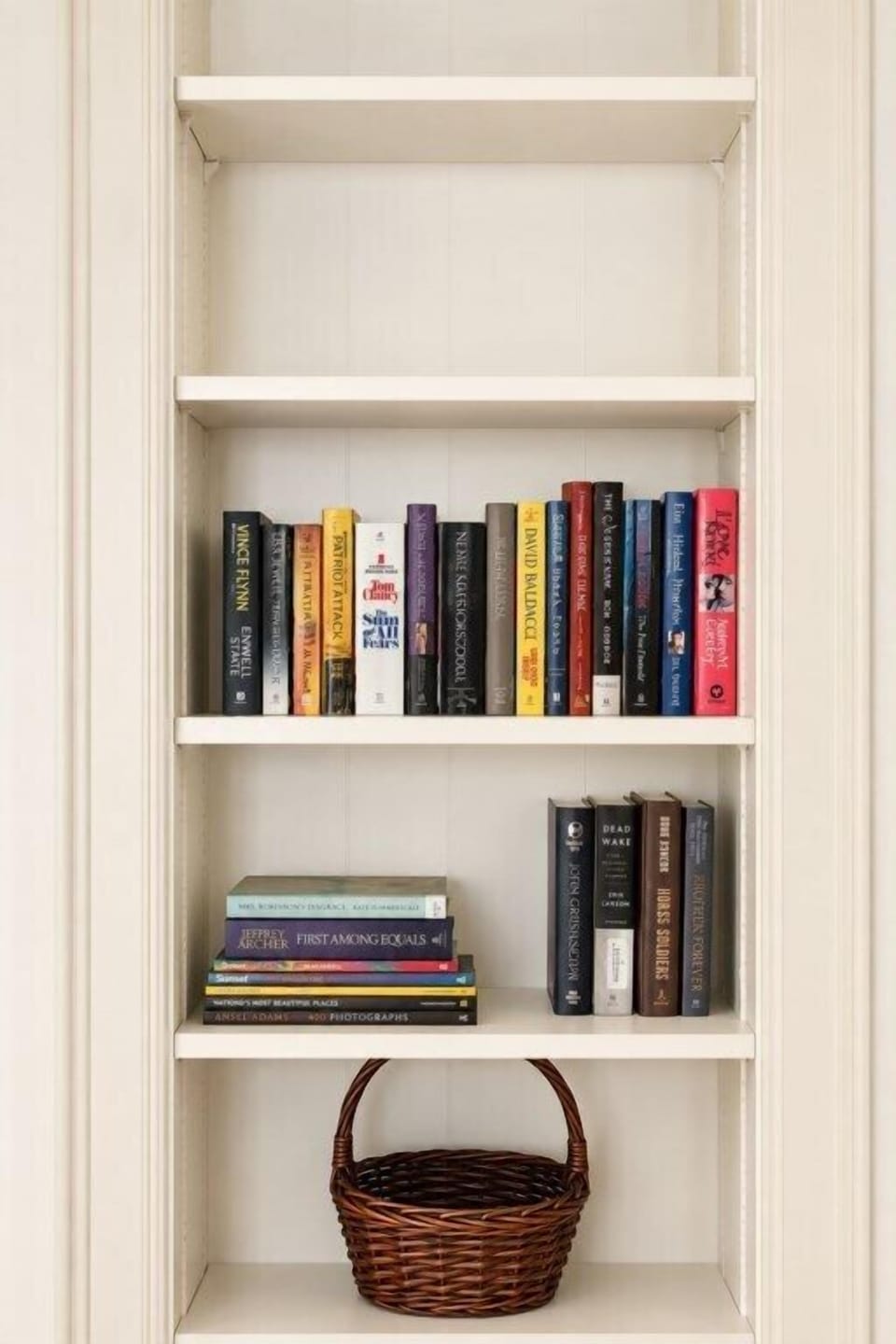 Built-in bookshelves with a small collection of books and guest reading material.