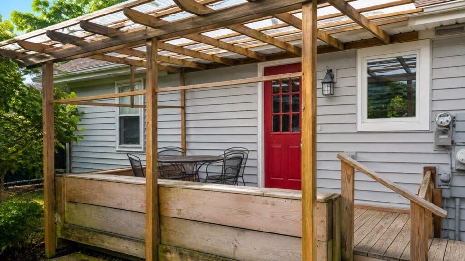 Back deck with outdoor dining area, pergola and easy access to the home.