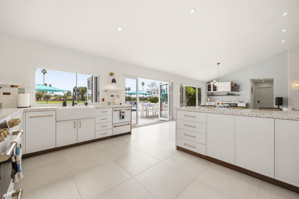 Fully equipped kitchen featuring custom tile and fun mid-century details.
