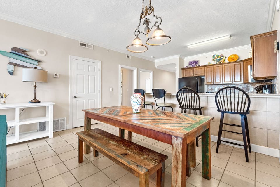 The dining area sits just off the kitchen and features a large table with seating for six.