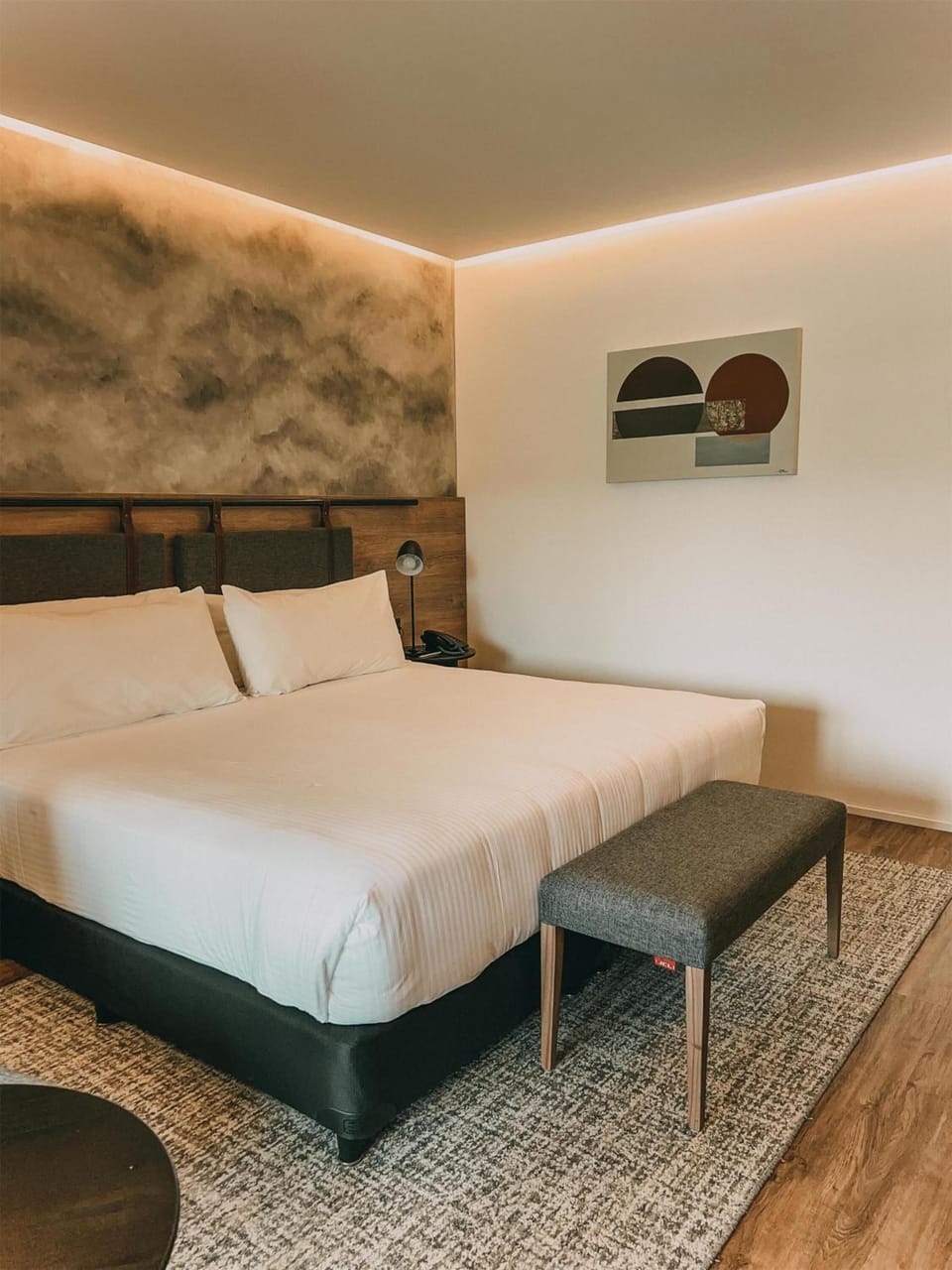 Stretch out on crisp linens under soft, ambient lighting.