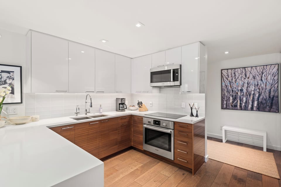 Fully-equipped kitchen with high-end finishes and built-in cabinetry.