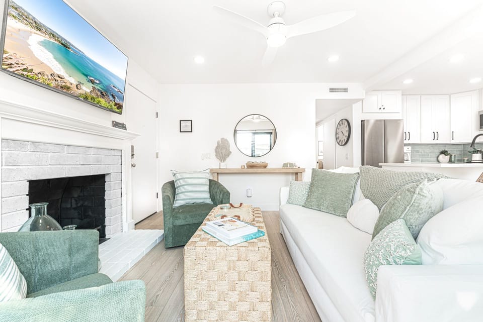 Curl up on the couch with streaming TV in this cozy living space, your home away from home just steps from the sand
                