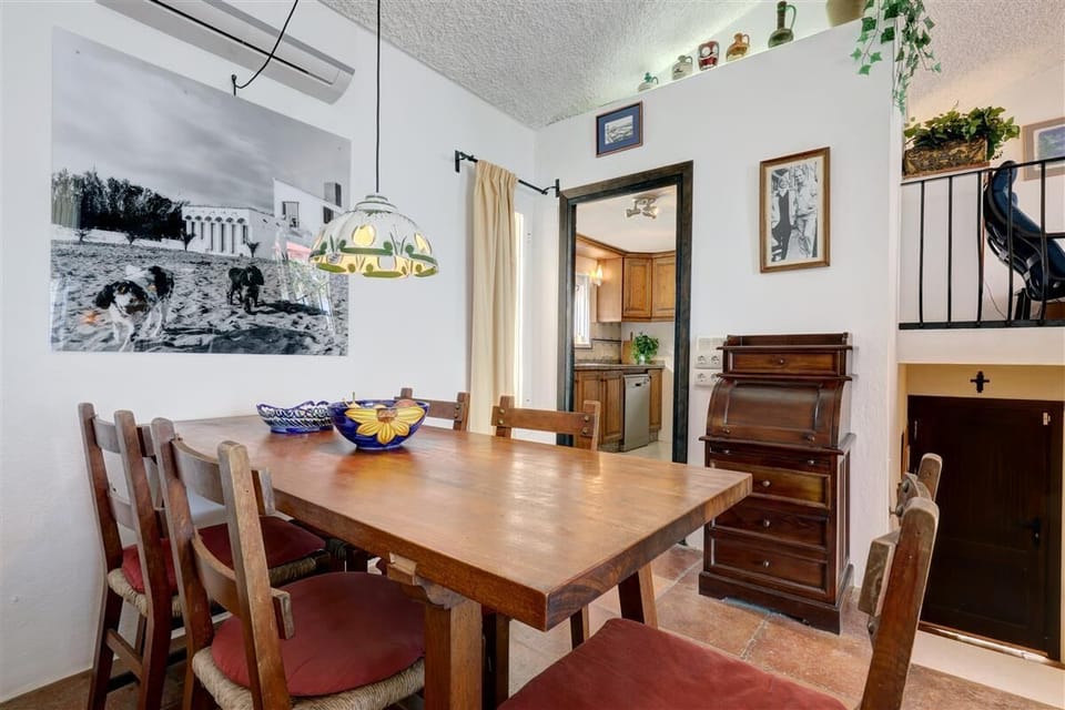Dining area for six guests on a side of the living room