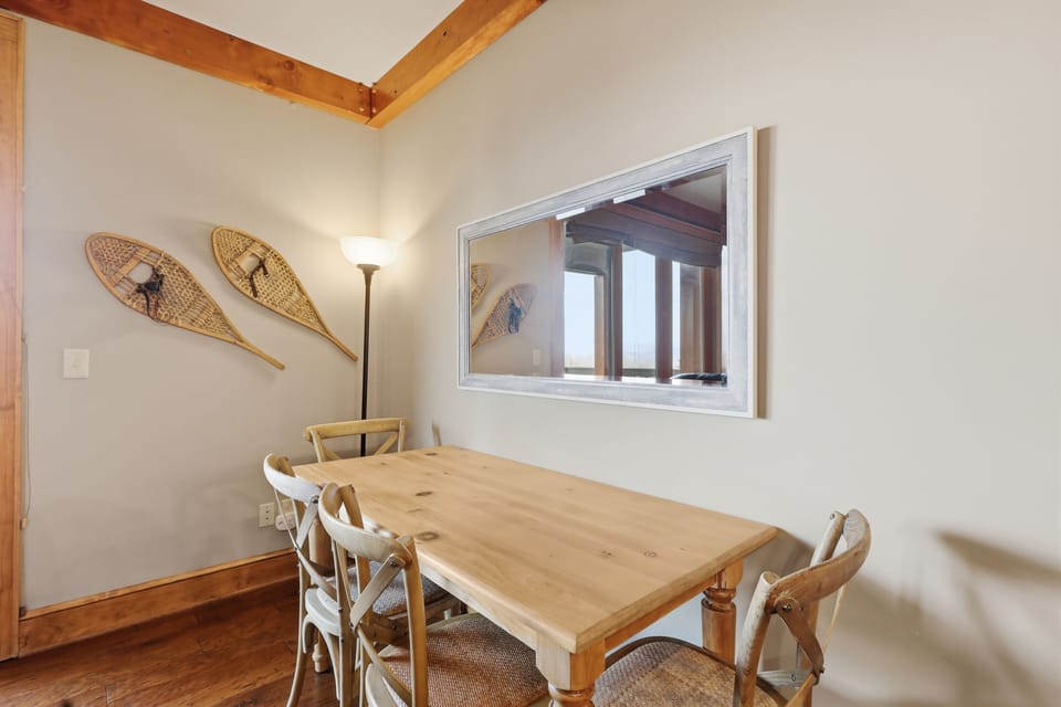 Dining area seats the whole group with mountain views nearby