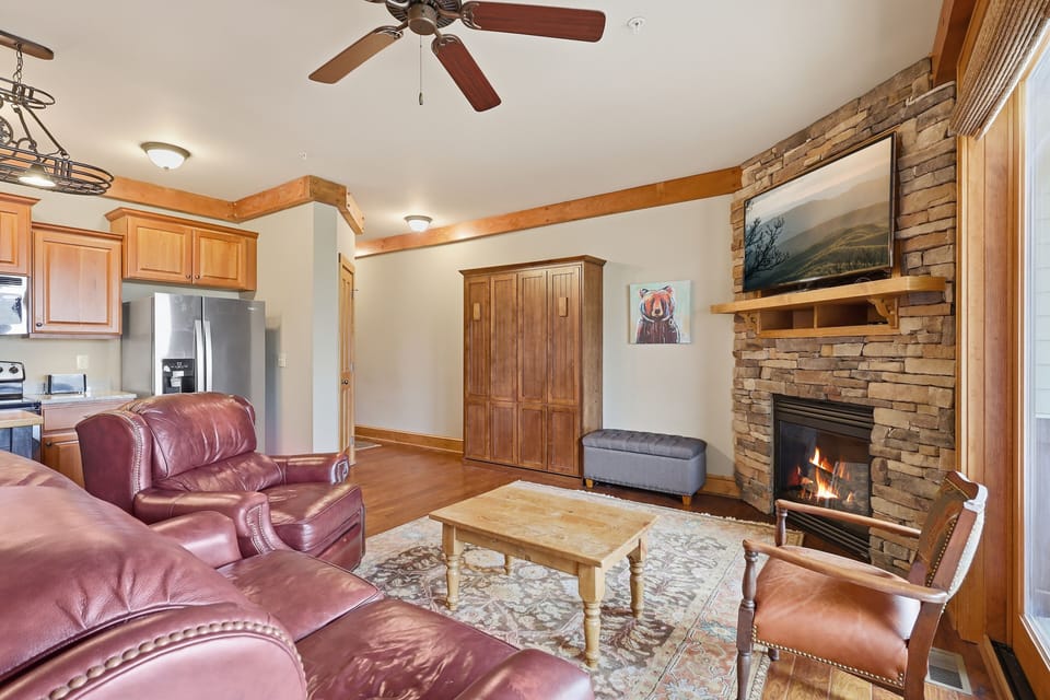 Everything you need — cozy seating, kitchen & mountain views all around