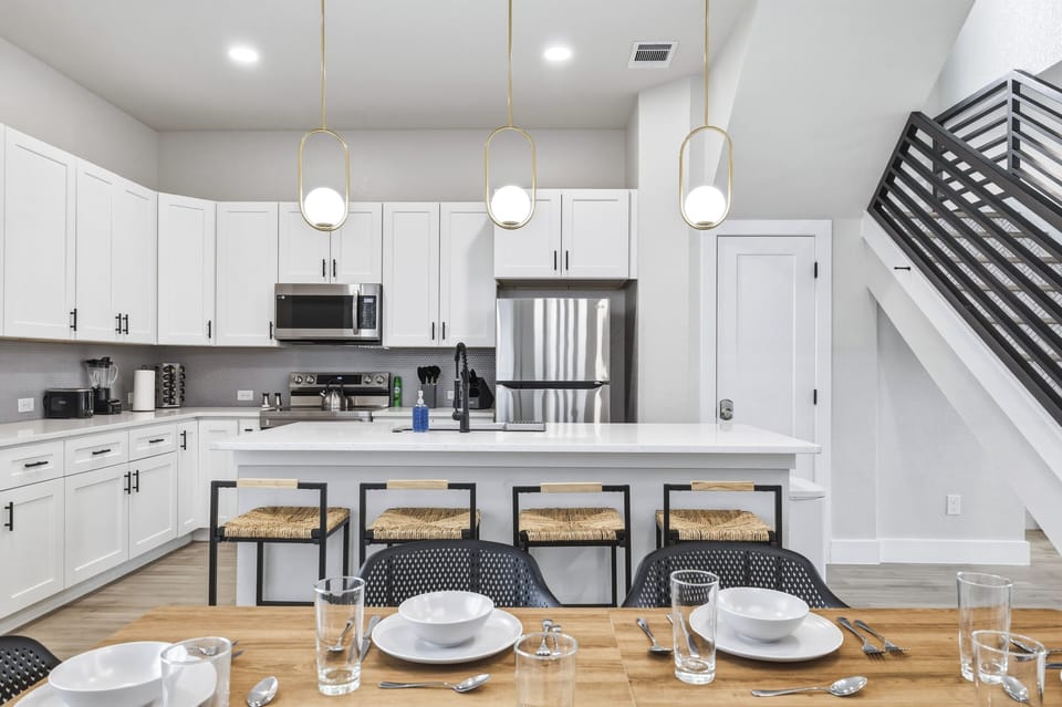 We have 4 barstools for your convenience! Fridge does NOT dispense water or ice. 