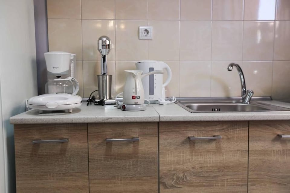 Compact kitchen with everything you need for coffee, breakfast, or light cooking.