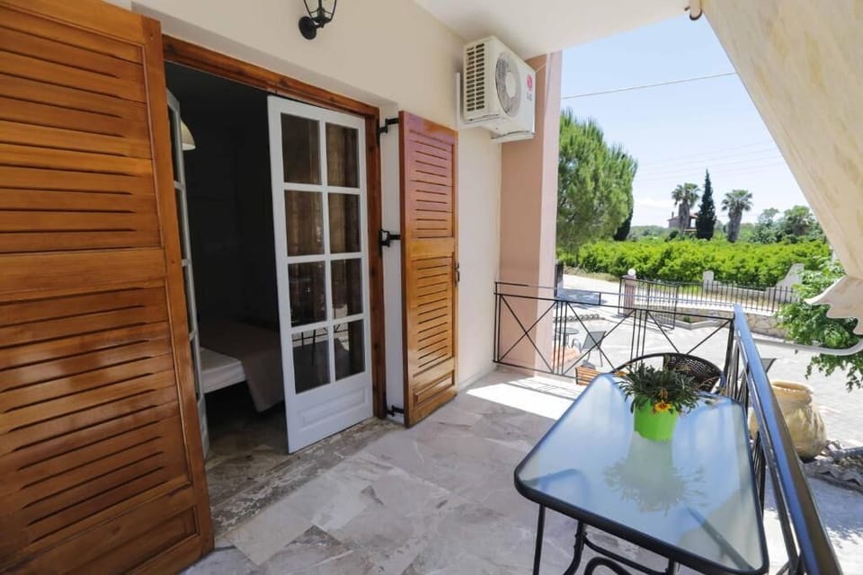 Shaded terrace outside the apartment — a great place to unwind.
