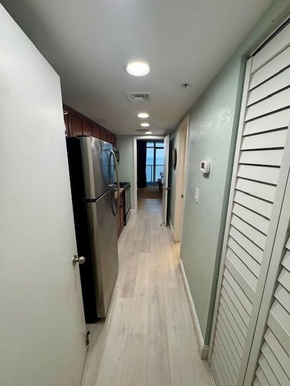Hallway from bedroom through kitchen