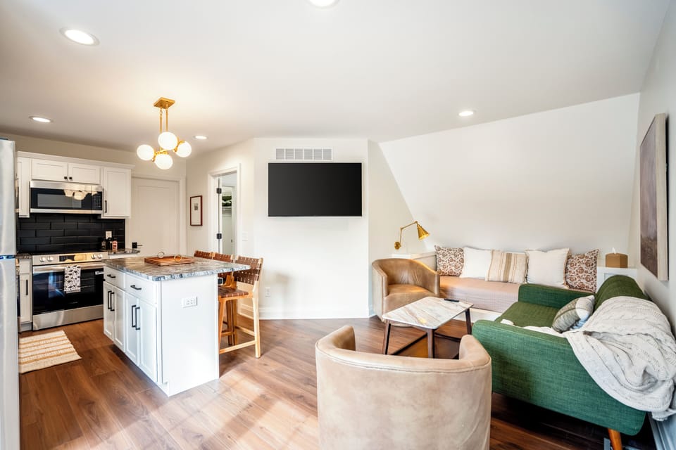 Comfortable living room area with a cozy couch and chairs—perfect for relaxing.