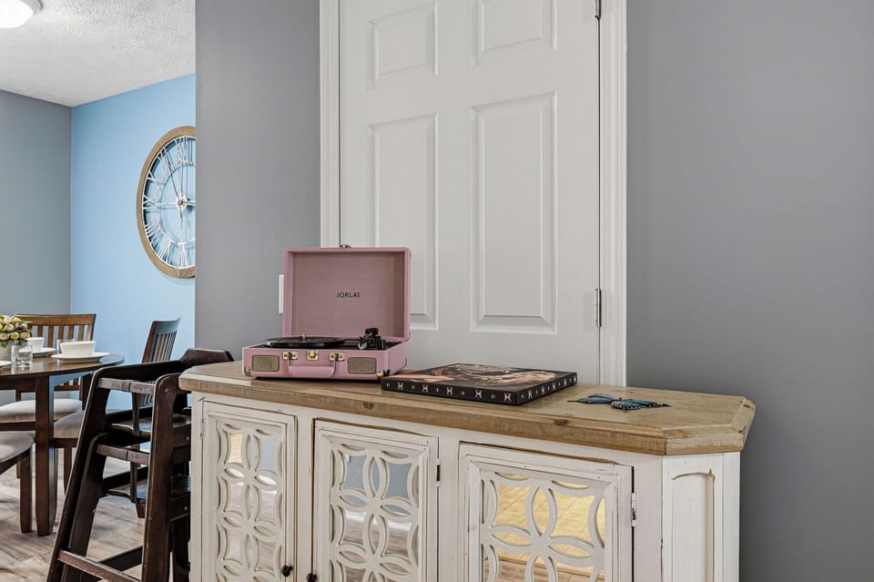 Enjoy vinyl records on your vintage turntable while relaxing in this thoughtfully designed living space.