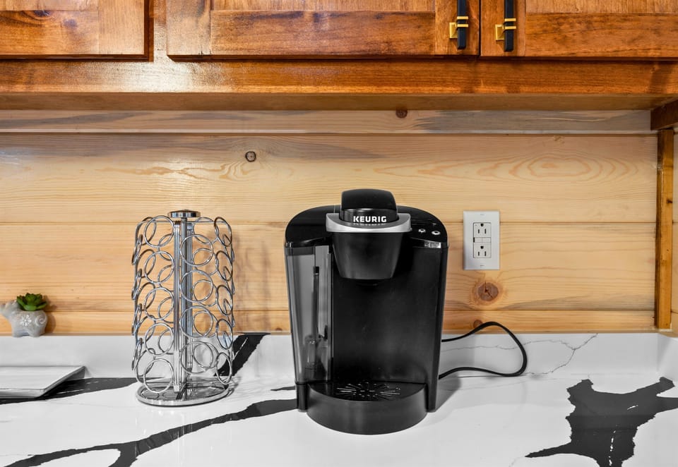 A convenient coffee station is ready for early mornings, so you can brew a fresh cup before heading out for the day.