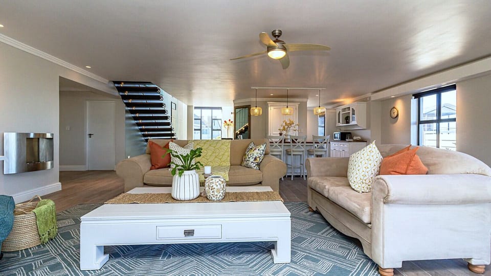 Downstairs lounge with open plan kitchen