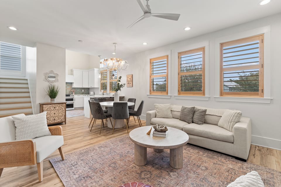 Unwind in your bright, modern living space with sofa seating, dining table, and fully equipped kitchen—all bathed in natural light.