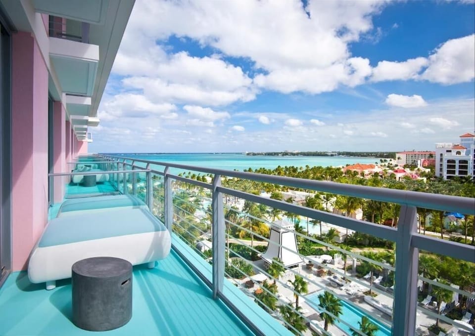 Sip cocktails on the balcony with sweeping turquoise water views.