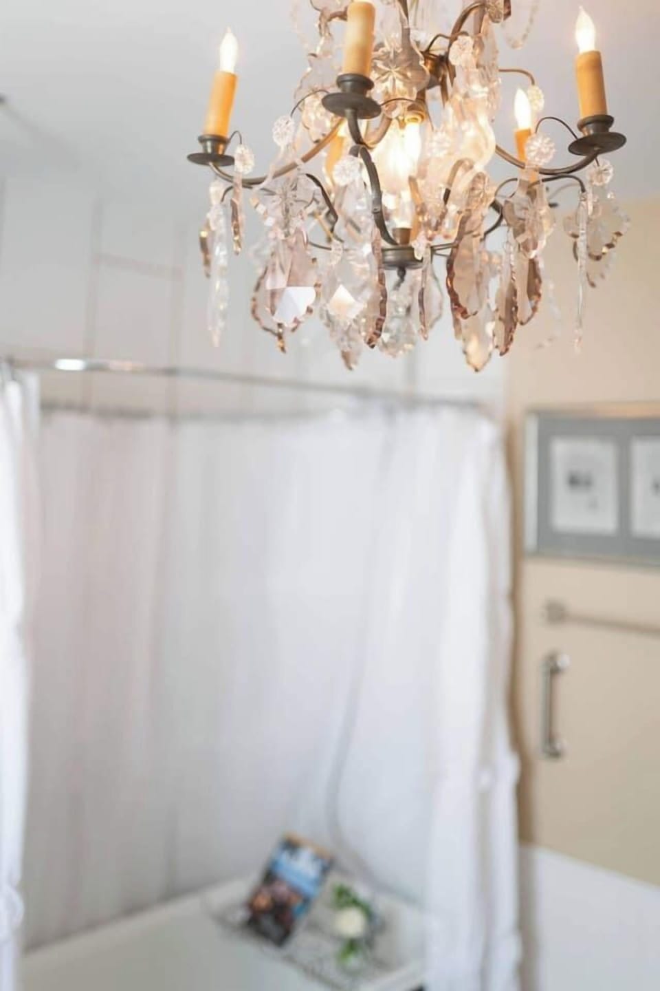 Indulge in a relaxing soak in your authentic 100+ year old clawfoot bathtub, Enjoy a complimentary bubble bath under the glow of a stunning crystal chandelier for the ultimate spa-like experience.
