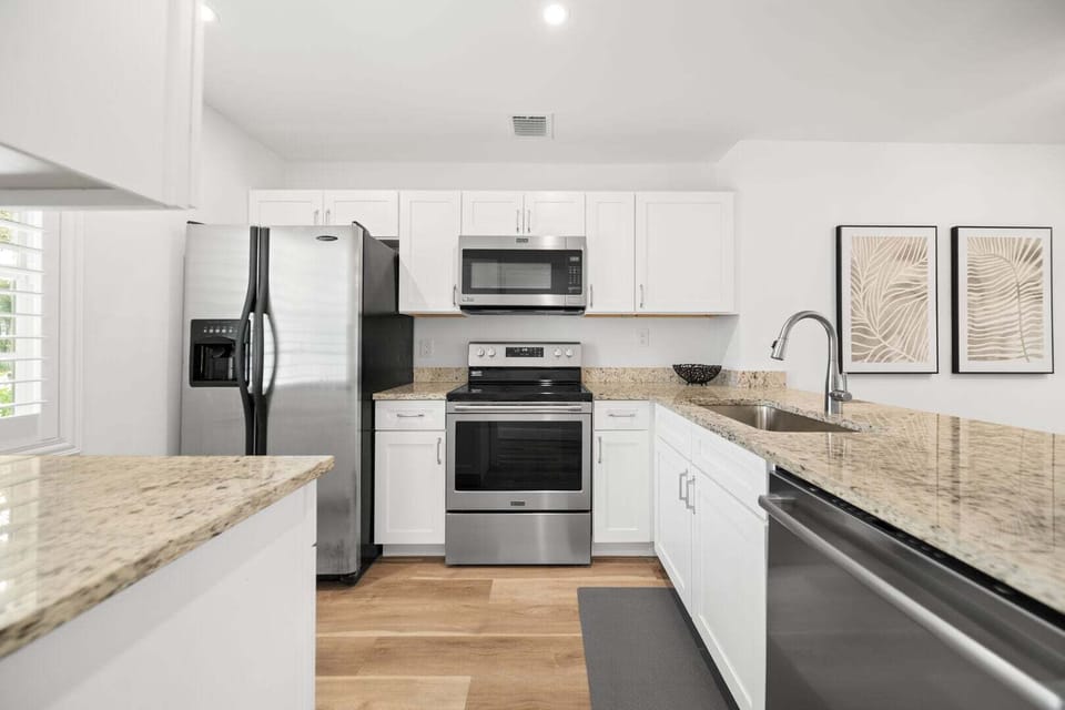 Fully stocked kitchen with all the utensils & pots and pans you need